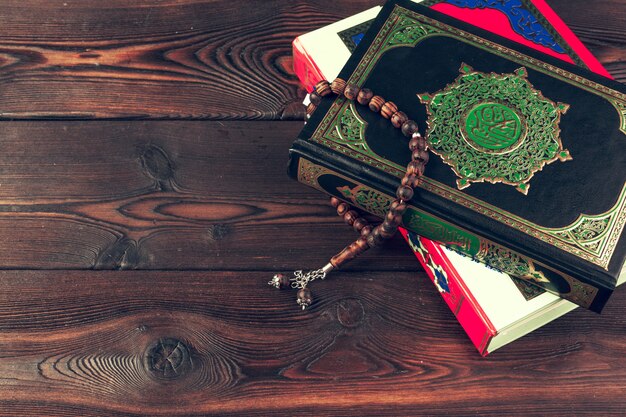 Islamic holy book on wooden table