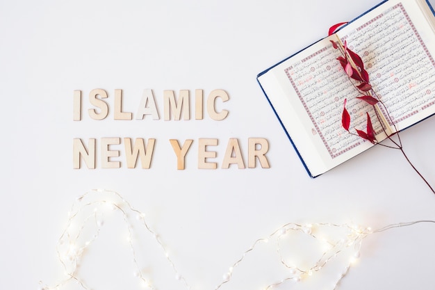 Photo islamic new year words with branch in koran
