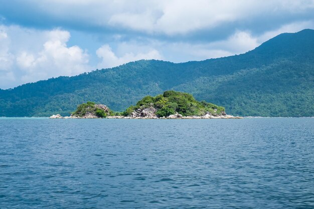 Island green rock mountain on middle sea