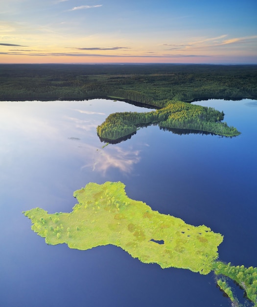 Island on lake during sunset aerial view Nature landscape composition