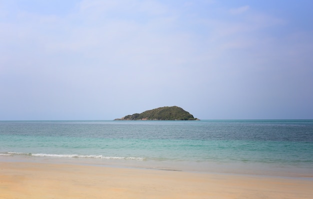 Island in the sea and bright sky.