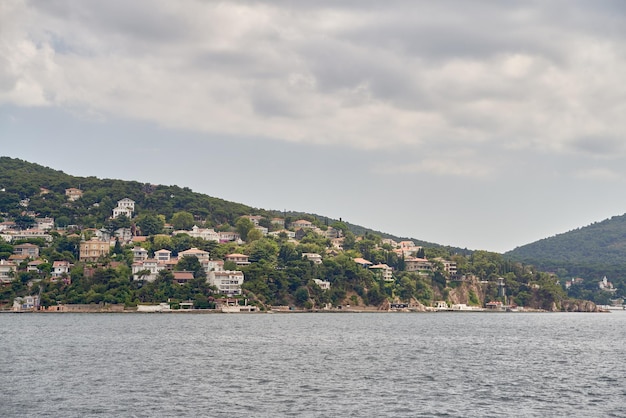 Island shoreline with buildings and trees view from water