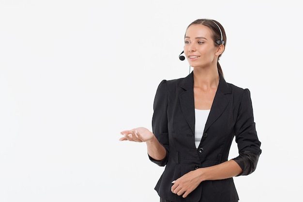 Isolated attractive woman in black costume with headphone looking away