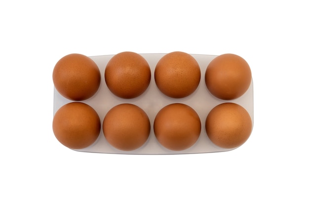 Isolated brown eggs on white background