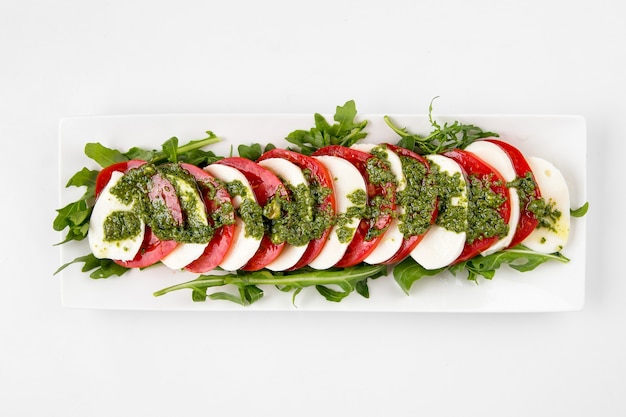 Isolated caprese salad with mozzarella and tomato