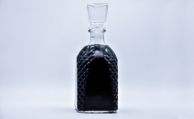 Isolated carafe with a black liquid