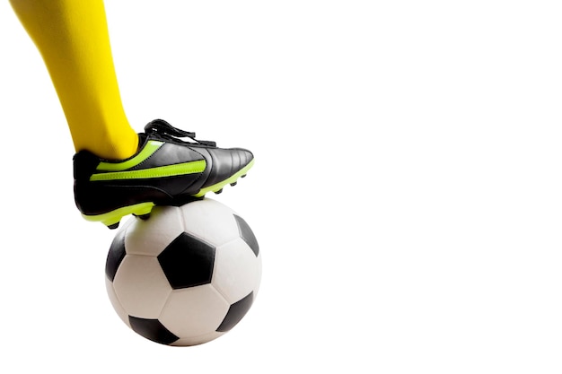 Isolated Close up shot of soccer player feet kicking soccer ball over white background