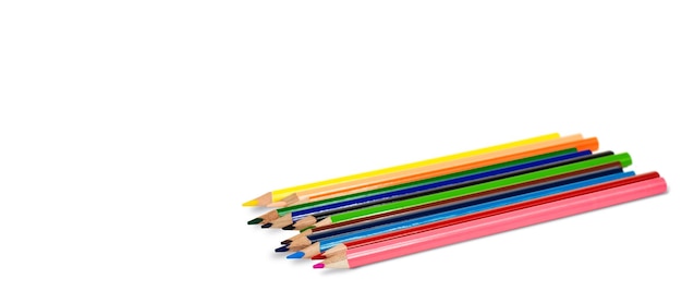 isolated colored pencils lie on a white background