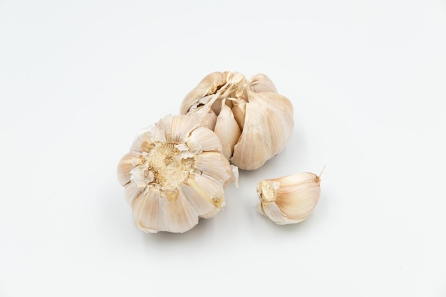 Isolated fresh raw garlic on white background