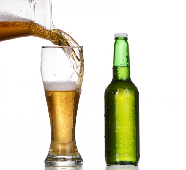 Isolated Glass and Brown bottle of beer on white