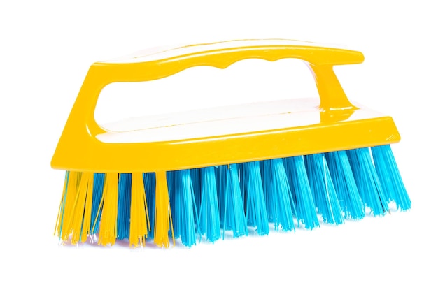 Isolated kitchen scrubbrush with yellow handle