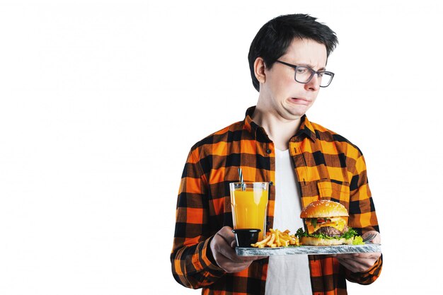 Isolated man refusing unhealthy burger.