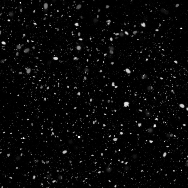 Foto effetto texture neve bianca naturale isolata su sfondo nero notte