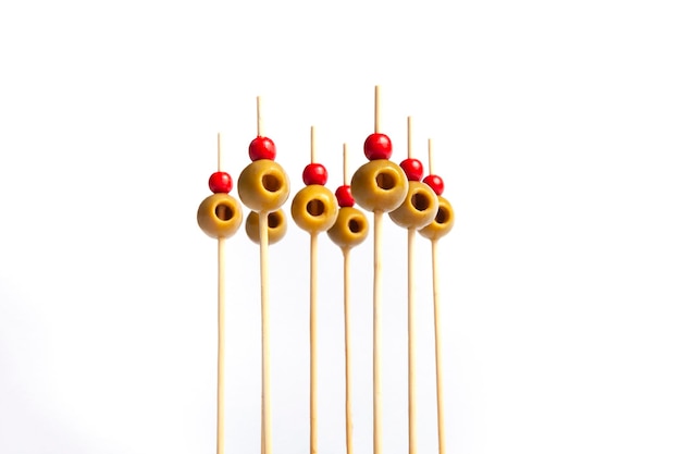 Isolated olives on skewers