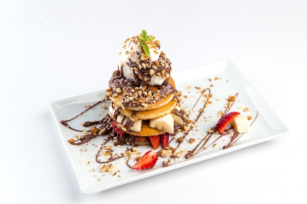 Isolated pancakes dessert with ice cream chocolate