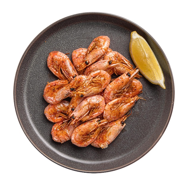 Isolated plate of fried garlic shrimp with lemon