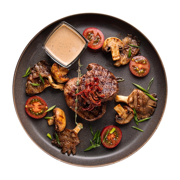 Isolated plate of grilled medallion steak