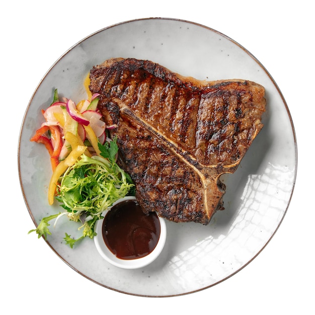 Isolated portion of grilled beef tbone steak