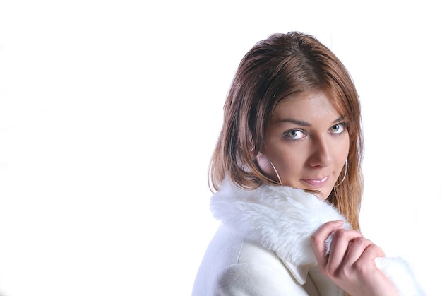 Isolated portrait of beautiful woman in a winter coat