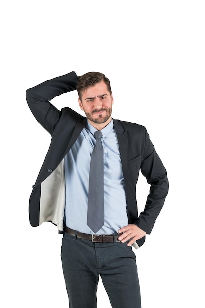 Isolated portrait of confused thinking bearded businessman scratching his head. Concept of decision making