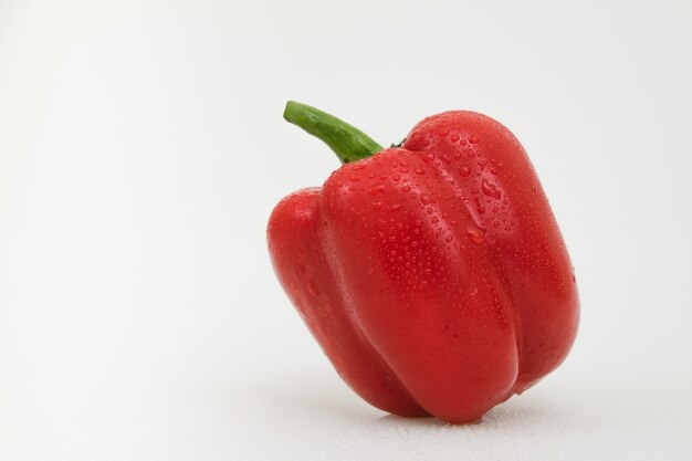 Isolated red pepper vegetable on white.