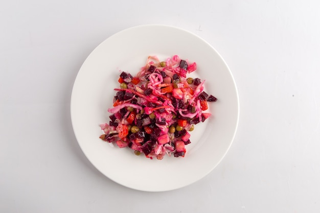 Isolated russian national beetroot salad vinaigrette on the white