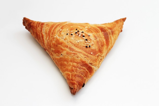 Isolated samosa on white, Eastern food.