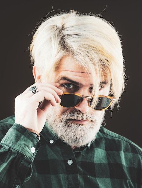 Photo isolated shot of young handsome male with beard mustache and trendy hairdo