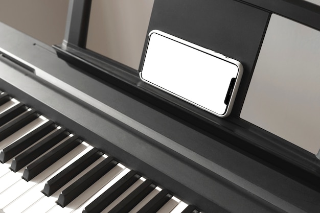 Isolated smartphone screen near the piano