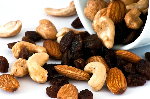 Isolated Spilled mixed nuts on white background