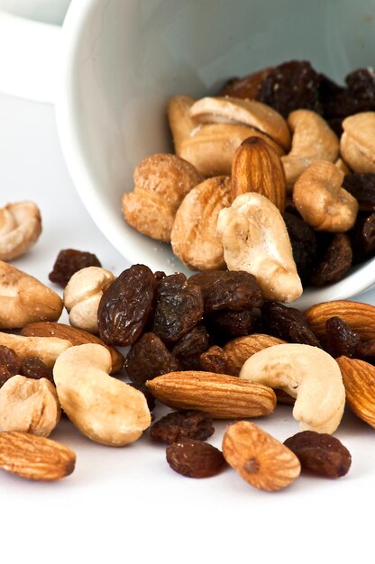 Isolated Spilled mixed nuts on white background