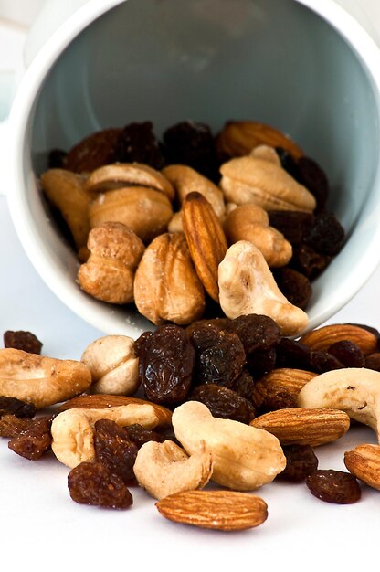 Isolated Spilled mixed nuts on white background