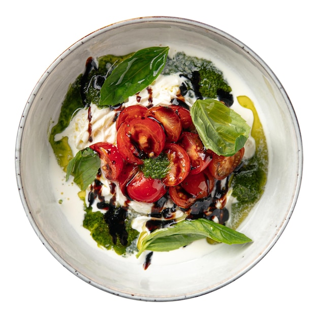 Isolated stracciatella with tomatoes and pesto