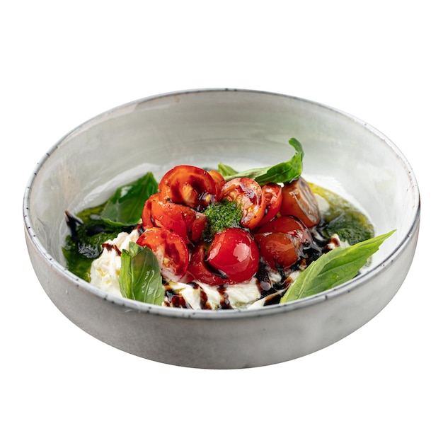 Isolated stracciatella with tomatoes and pesto