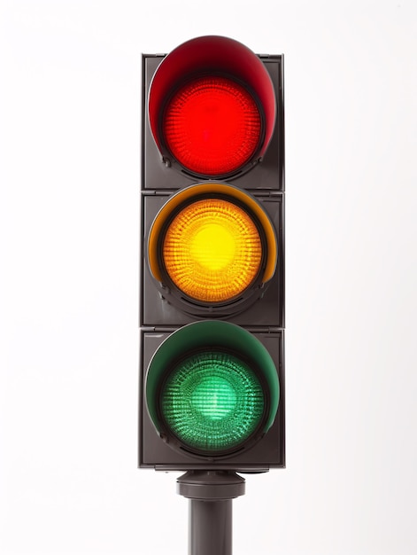 An isolated studiocaptured image of a traffic signal with amber verdant and crimson luminescence is presented on a plain white backdrop