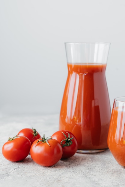 Isolated vertical shot of freshly made tomato juice