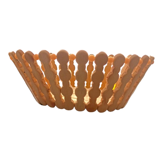 Isolated vintage orange food basket with a candle holder wood pattern front view