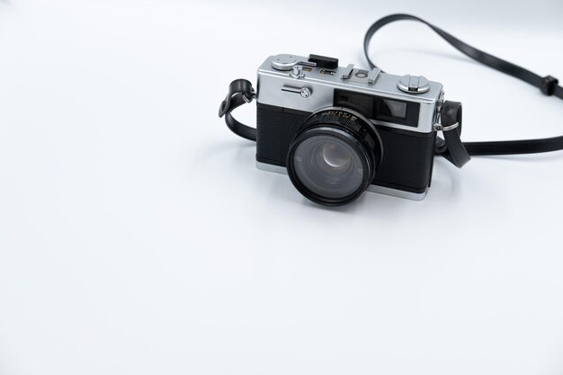 Isolated white background Beautiful vintage analog rangefinder film camera 70's Decade copy space