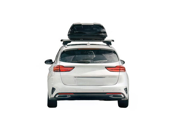 Photo isolated on white background rooftop cargo carrier roof box view of a vehicle with a roof box black luggage compartment box on a sport car