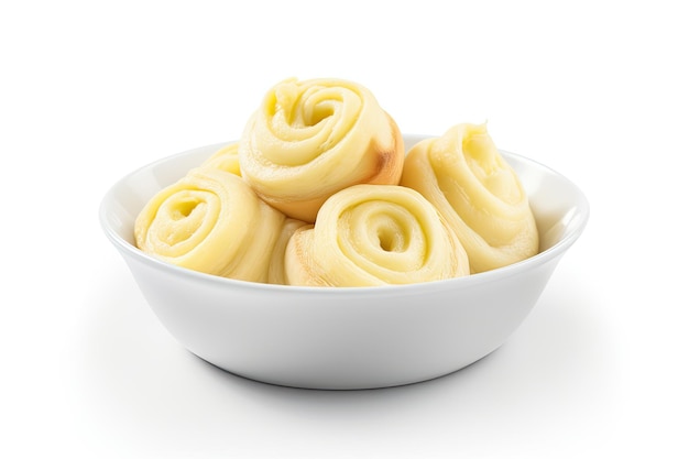 Isolated white bowl with butter curls rolls