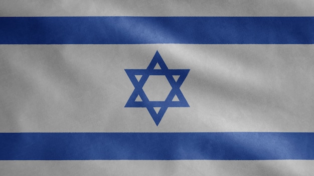 Photo israeli flag waving in the wind. close up of israel banner blowing smooth silk