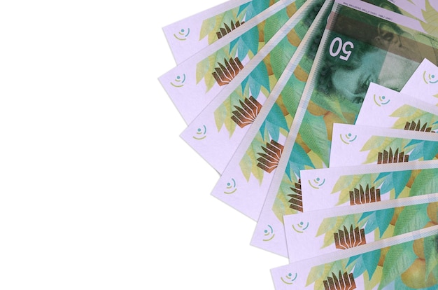 Israeli new shekels bills laying on white surface