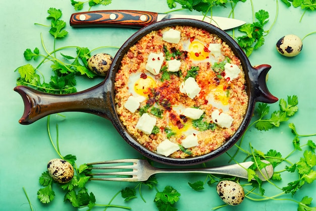 Israeli shakshuka made from fried eggs, tomato, minced lamb and hot spices.