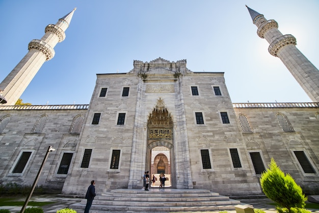 ISTANBUL / TURKEY - OCTOBER 10, 2019: Entrance to the Courtyard of old great Suleymaniye Mosque in Istanbul, Turkey is a famous landmark of the city. Magnificent Islamic Ottoman architecture.