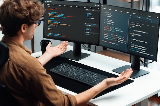 it developer working online software development coding on pc screens gusher