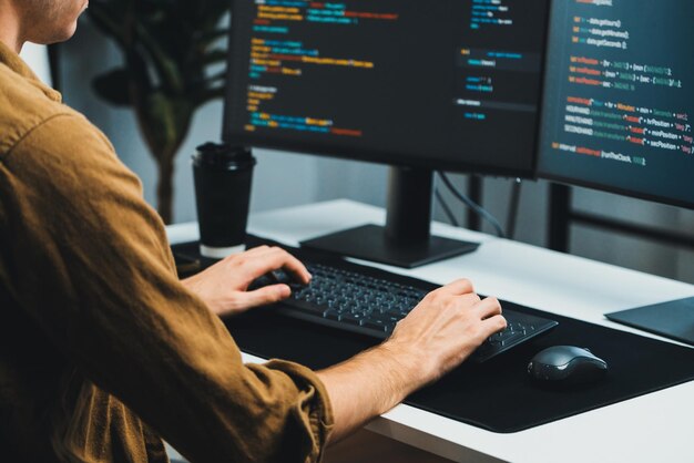 it developer working online software development coding on pc screens gusher