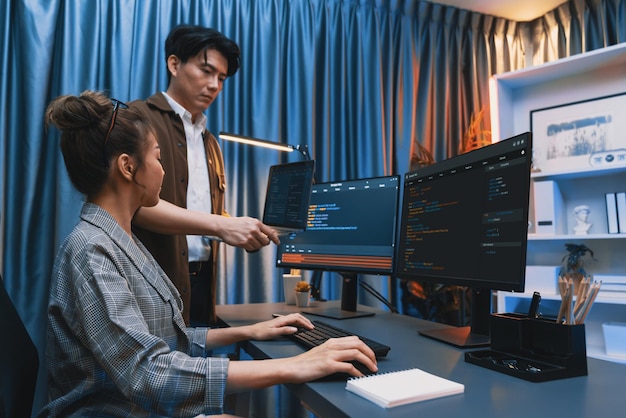 IT developers discussing intelligent website with laptop showing data Infobahn