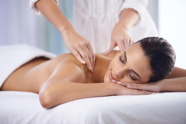 It doesnt get anymore relaxing Cropped shot of a beautiful young woman relaxing during spa treatment