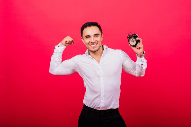 It is your time portrait of young man in showing time on clock watch ok thumb up approve