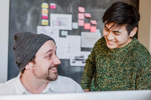 IT officer talking with a colleague in the office